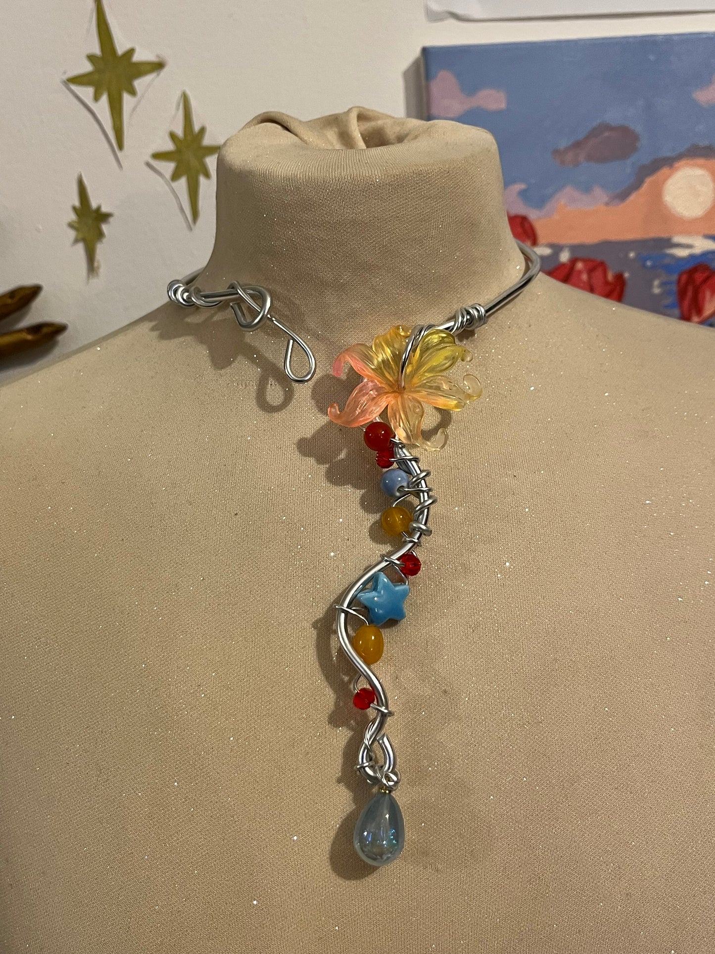 collana fiore arancione blu